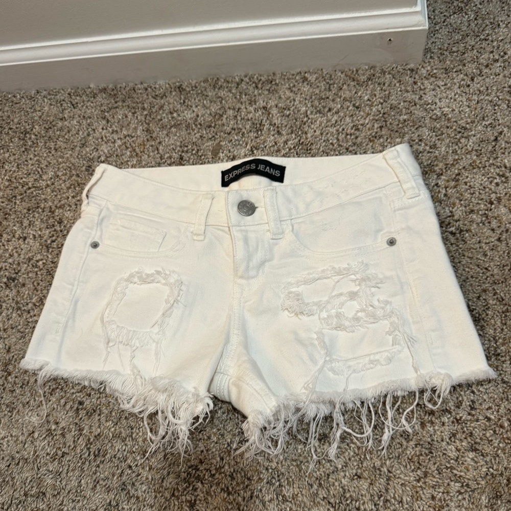 Express white Jean shorts with distressed detail